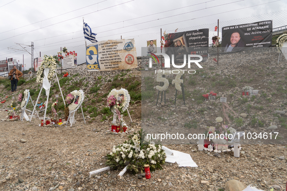 Flowers are forming the number 57, representing the number of individuals who died in the train crash, in Tempi Thessaly, Greece, on on Febr...