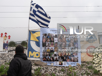 A relative of a girl who died while being a passenger on the train is hugging the wire fence of the railway track and mourning the loss of h...