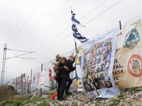 A relative of a girl who died while being a passenger on the train is hugging the wire fence of the railway track and mourning the loss of h...