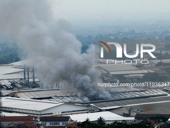 A fire is happening at the Kahatex Factory complex in Sumedang Regency, Indonesia, on February 29, 2024. Authorities are currently investiga...