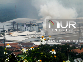 A fire is happening at the Kahatex Factory complex in Sumedang Regency, Indonesia, on February 29, 2024. Authorities are currently investiga...