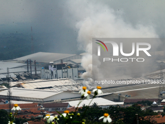 A fire is happening at the Kahatex Factory complex in Sumedang Regency, Indonesia, on February 29, 2024. Authorities are currently investiga...