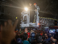 Firefighters are rescuing people from the roof after a fire broke out in a multi-storey building in Dhaka, Bangladesh, on February 29, 2024....