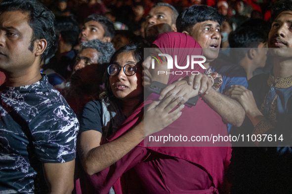 People are searching for their loved ones after a fire erupted in a multi-storey building in Dhaka, Bangladesh, on February 29, 2024. At lea...