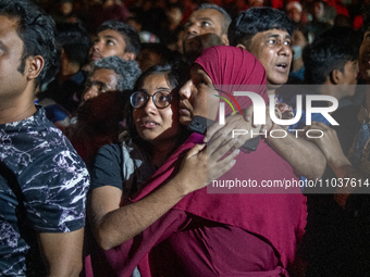 People are searching for their loved ones after a fire erupted in a multi-storey building in Dhaka, Bangladesh, on February 29, 2024. At lea...