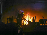 Firefighters are rescuing people from the roof after a fire broke out in a multi-story building in Dhaka, Bangladesh, on February 29, 2024....