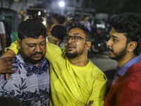 Relatives of victims are searching for their loved ones following a fire that broke out in a multi-story building in Dhaka, Bangladesh, on F...