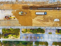 Workers are working on a flood control and drainage project at a construction site in Yuexi County, Anqing, China, on March 1, 2024. (