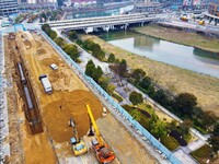 Workers are working on a flood control and drainage project at a construction site in Yuexi County, Anqing, China, on March 1, 2024. (