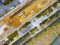 Workers are working on a flood control and drainage project at a construction site in Yuexi County, Anqing, China, on March 1, 2024. (