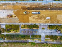 Workers are working on a flood control and drainage project at a construction site in Yuexi County, Anqing, China, on March 1, 2024. (