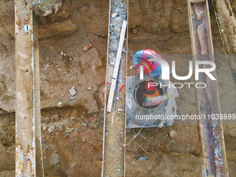 Workers are working on a flood control and drainage project at a construction site in Yuexi County, Anqing, China, on March 1, 2024. (