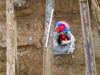 Workers are working on a flood control and drainage project at a construction site in Yuexi County, Anqing, China, on March 1, 2024. (