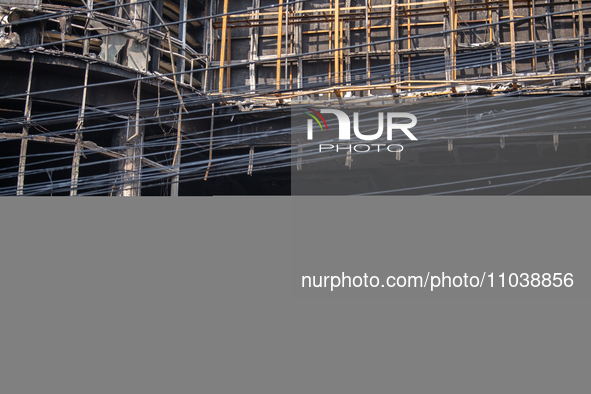 Firefighters and forensic experts are inspecting a commercial building in Dhaka, Bangladesh, on March 1, 2024, the day after a fire claimed...