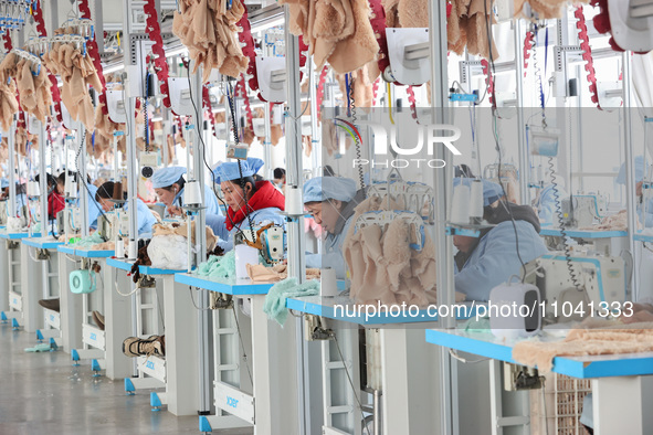 Workers at a toy export enterprise are producing plush toys for export in Lianyungang, China, on March 2, 2024. 