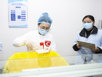 College students are participating in a biochemistry and immunology test competition in Huai'an, China, on March 2, 2024. (