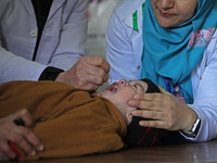 A health worker is administering polio vaccine drops to a child in Srinagar, Kashmir, India, on March 3, 2024. A three-day pulse polio vacci...