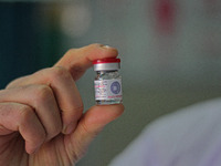 A health worker is showing a vial of polio vaccine at a health center in Srinagar, Kashmir, India, on March 3, 2024. A three-day pulse polio...