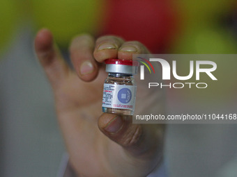 A health worker is showing a vial of polio vaccine at a health center in Srinagar, Kashmir, India, on March 3, 2024. A three-day pulse polio...