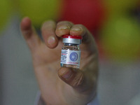 A health worker is showing a vial of polio vaccine at a health center in Srinagar, Kashmir, India, on March 3, 2024. A three-day pulse polio...