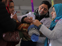 Health workers are administering polio vaccine drops to a child in Srinagar, Kashmir, India, on March 3, 2024. A three-day pulse polio vacci...