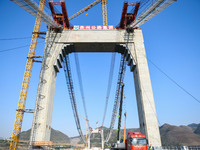 Workers are working at the construction site of Jinzhou Bridge in Xingyi City, Qiandinan Buyi and Miao Autonomous Prefecture, Guizhou Provin...