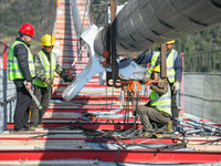 Workers are working at the construction site of Jinzhou Bridge in Xingyi City, Qiandinan Buyi and Miao Autonomous Prefecture, Guizhou Provin...