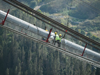 Workers are working at the construction site of Jinzhou Bridge in Xingyi City, Qiandinan Buyi and Miao Autonomous Prefecture, Guizhou Provin...