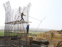 Workers are carrying out railway pier and column construction at the Fanji town section of the Nanjing-Huai'an Intercity Railway under const...