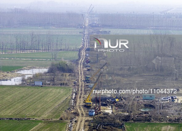 Workers are carrying out railway pier and column construction at the Fanji town section of the Nanjing-Huai'an Intercity Railway under const...