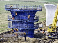 Workers are carrying out railway pier and column construction at the Fanji town section of the Nanjing-Huai'an Intercity Railway under const...