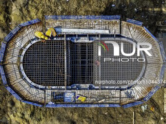 Workers are carrying out railway pier and column construction at the Fanji town section of the Nanjing-Huai'an Intercity Railway under const...