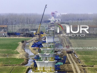 Workers are carrying out railway pier and column construction at the Fanji town section of the Nanjing-Huai'an Intercity Railway under const...