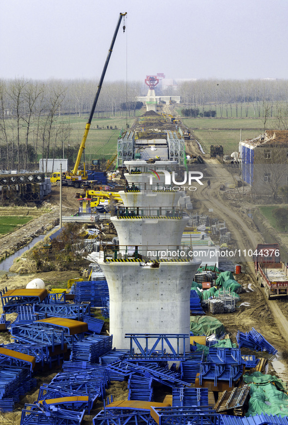 Workers are carrying out railway pier and column construction at the Fanji town section of the Nanjing-Huai'an Intercity Railway under const...