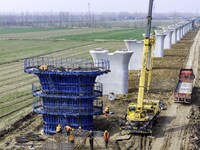 Workers are carrying out railway pier and column construction at the Fanji town section of the Nanjing-Huai'an Intercity Railway under const...