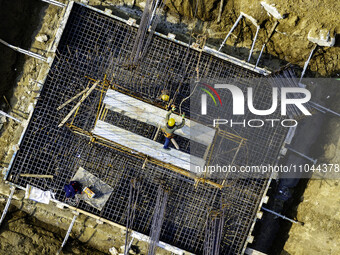 Workers are carrying out railway pier and column construction at the Fanji town section of the Nanjing-Huai'an Intercity Railway under const...