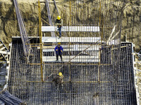 Workers are carrying out railway pier and column construction at the Fanji town section of the Nanjing-Huai'an Intercity Railway under const...