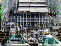 Workers are carrying out railway pier and column construction at the Fanji town section of the Nanjing-Huai'an Intercity Railway under const...