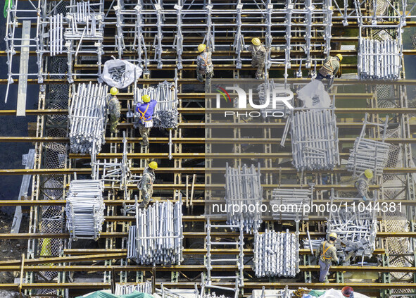 Workers are carrying out railway pier and column construction at the Fanji town section of the Nanjing-Huai'an Intercity Railway under const...