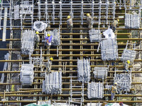 Workers are carrying out railway pier and column construction at the Fanji town section of the Nanjing-Huai'an Intercity Railway under const...