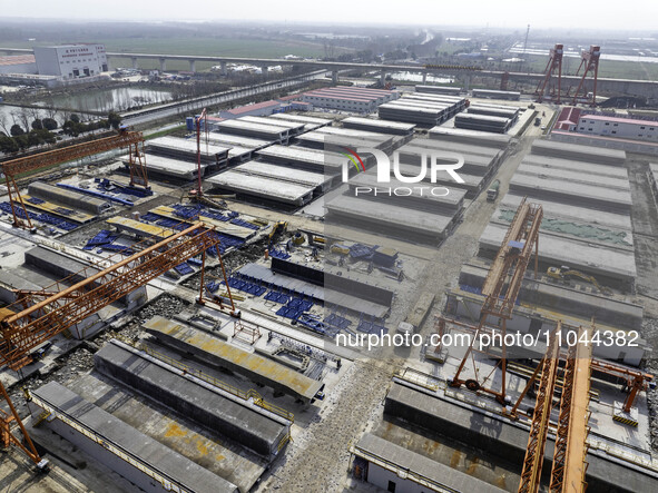 Workers are carrying out railway pier and column construction at the Fanji town section of the Nanjing-Huai'an Intercity Railway under const...