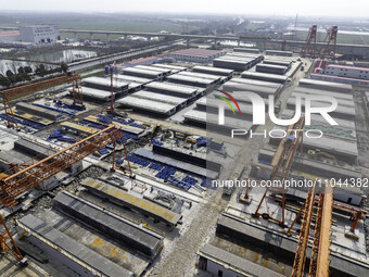 Workers are carrying out railway pier and column construction at the Fanji town section of the Nanjing-Huai'an Intercity Railway under const...