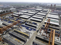 Workers are carrying out railway pier and column construction at the Fanji town section of the Nanjing-Huai'an Intercity Railway under const...