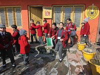 School children are arriving on the first day in Srinagar, Kashmir, on March 4, 2024. Schools across Kashmir are reopening after a three-mon...