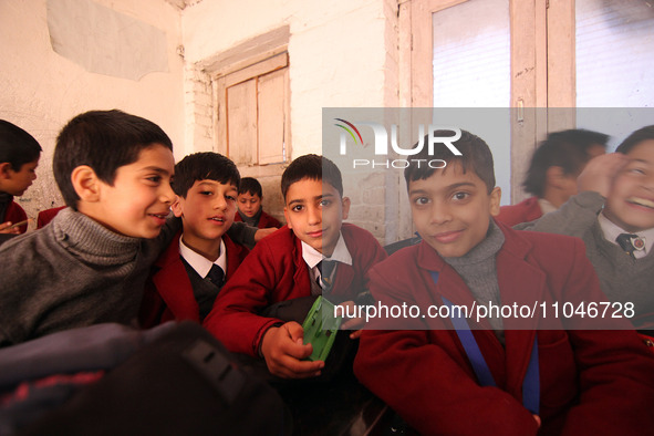 School boys are pictured on the first day of school in Srinagar, Kashmir, on March 4, 2024. Schools across Kashmir are reopening after a thr...