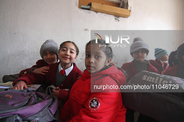 School girls are pictured on the first day of school in Srinagar, India, on March 4, 2024. Schools across Kashmir are reopening after a thre...