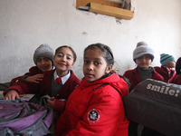 School girls are pictured on the first day of school in Srinagar, India, on March 4, 2024. Schools across Kashmir are reopening after a thre...