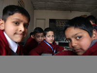 School boys are pictured on the first day of school in Srinagar, India, on March 4, 2024. Schools across Kashmir are reopening after a three...