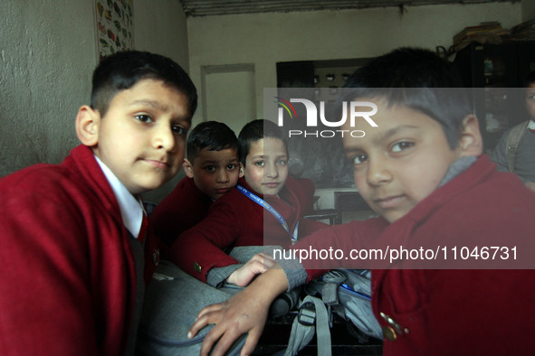 School boys are sitting inside the classroom on the first day in Srinagar, Kashmir, on March 4, 2024. Schools across Kashmir are reopening a...