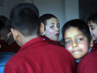 A school boy is pictured on the first day of school in Srinagar, Kashmir, on March 4, 2024. Schools across Kashmir are reopening after a thr...